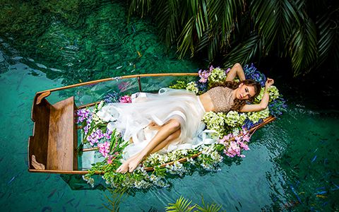 Quinceanera photography with canoe in Secret Garden